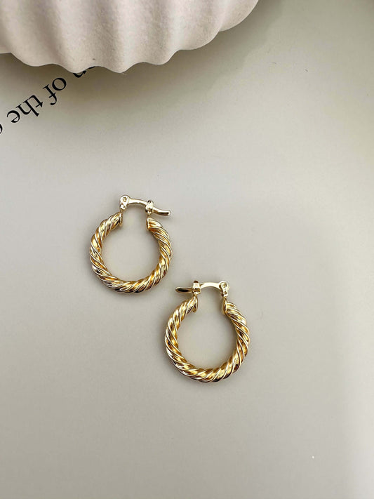 Velani Jewelry Twisted Hoop Earrings in 18K Gold Filled, hypoallergenic, waterproof, tarnish resistant, ideal for everyday wear.