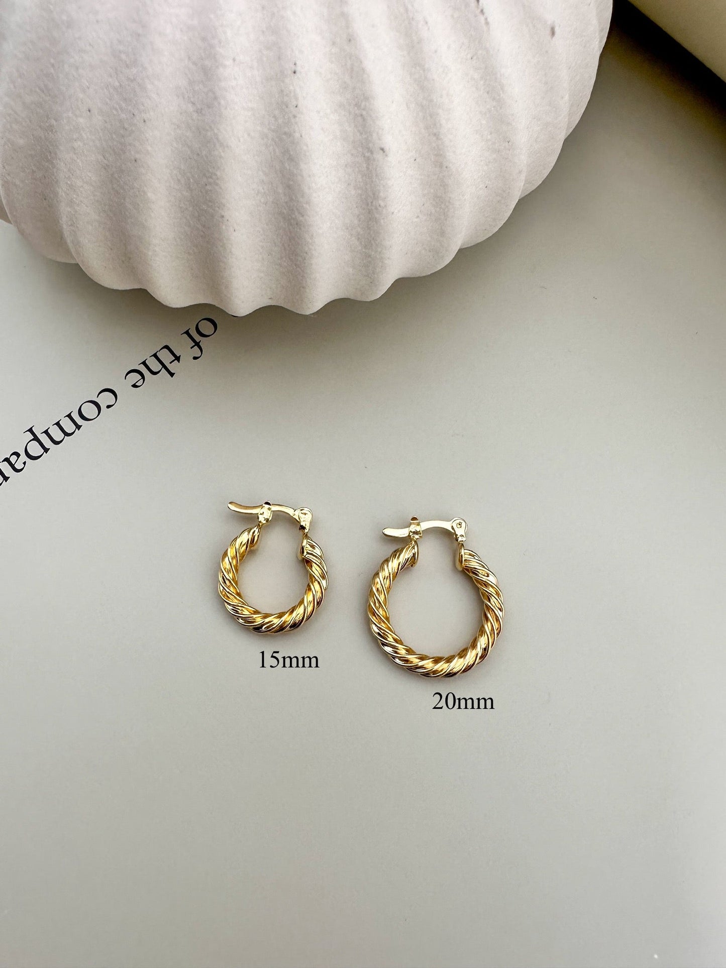 Velani Jewelry Twisted Hoop Earrings in 15mm and 20mm, 18K gold filled, hypoallergenic, lead and nickel free, handcrafted in Brazil.