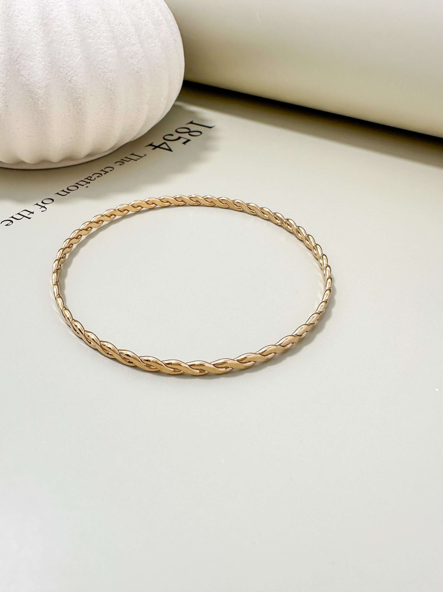 Velani Jewelry Woven Wire Bangle Bracelet in 14K Gold Filled, hypoallergenic, waterproof, and tarnish resistant for everyday wear.