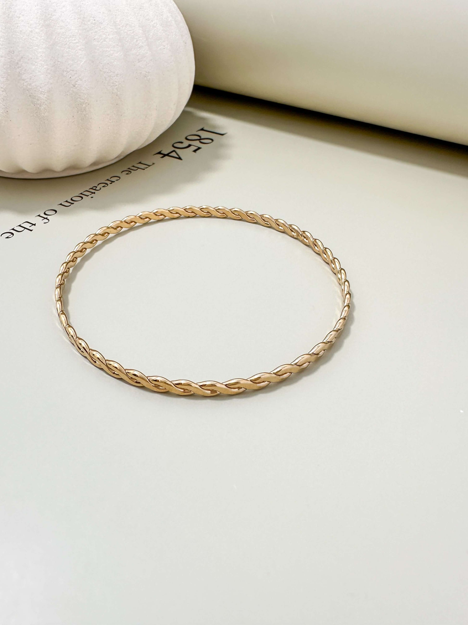 Velani Jewelry Woven Wire Bangle Bracelet in 14K Gold Filled, hypoallergenic, waterproof, and tarnish resistant for everyday wear.