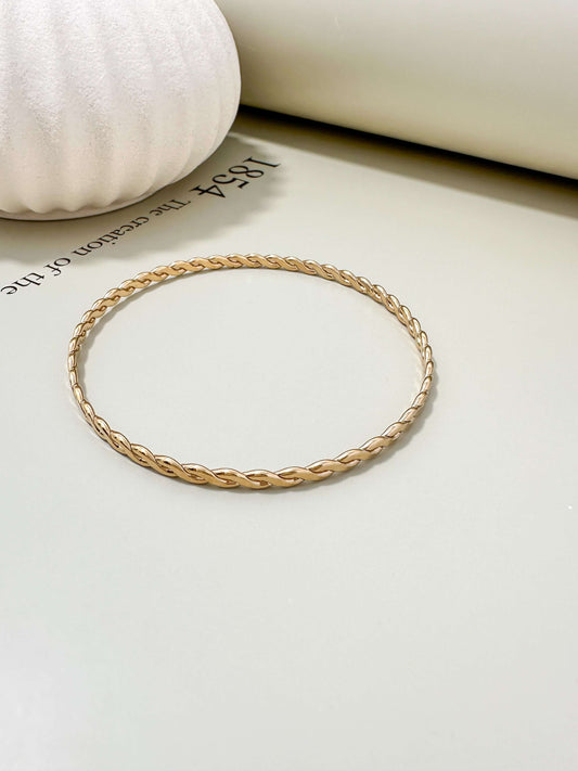 Velani Jewelry Woven Wire Bangle Bracelet in 14K Gold Filled, hypoallergenic, waterproof, and tarnish resistant for everyday wear.
